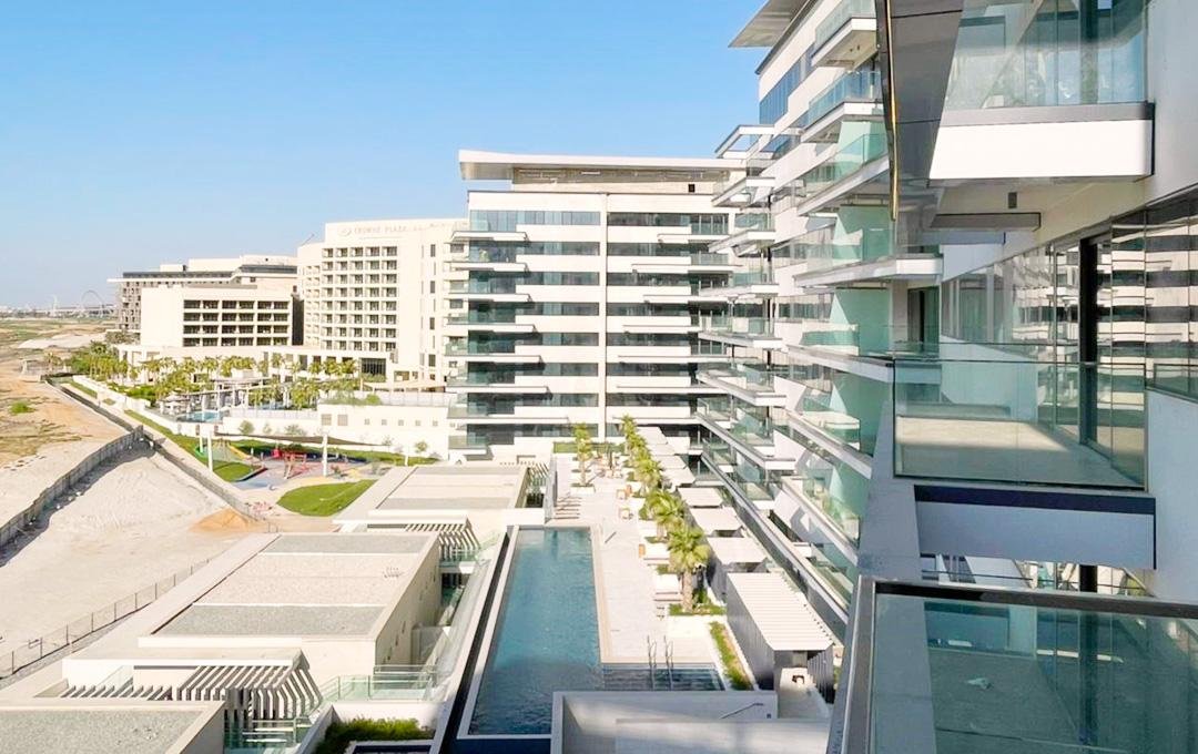 Mayan Yas Island community amenities including swimming pools, children’s play areas, and leisure spaces
